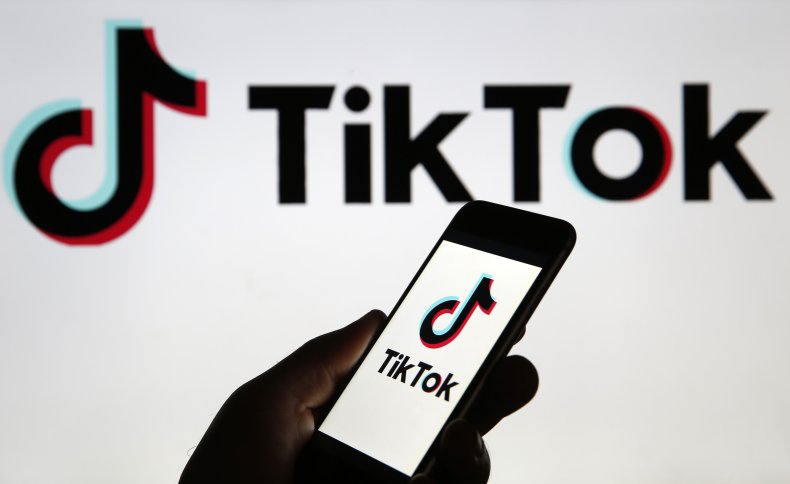 The TikTok logo on a phone screen.