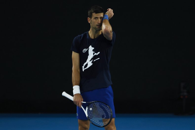 Novak Djokovic of Serbia wipes sweat