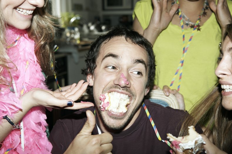 A man eating birthday cake.