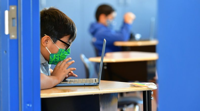 Students work on their laptop computers