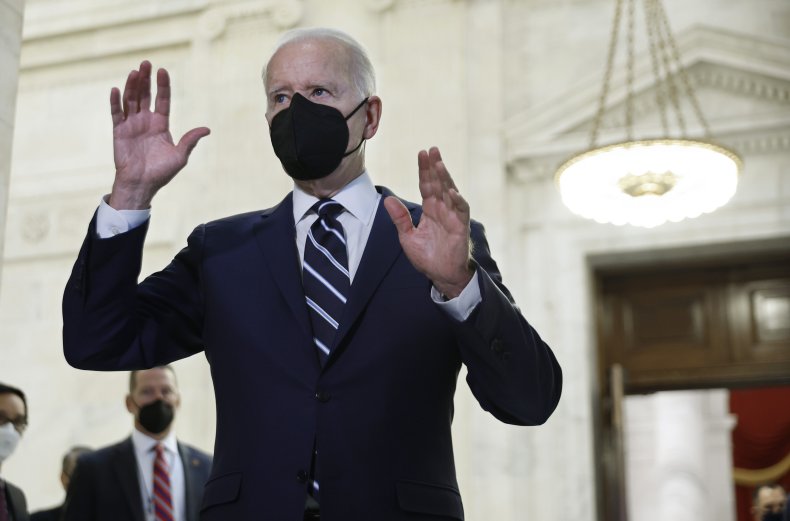 President Joe Biden talks to reporters