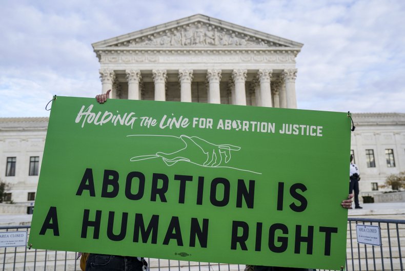 Participants hold signsduring abortion protest 