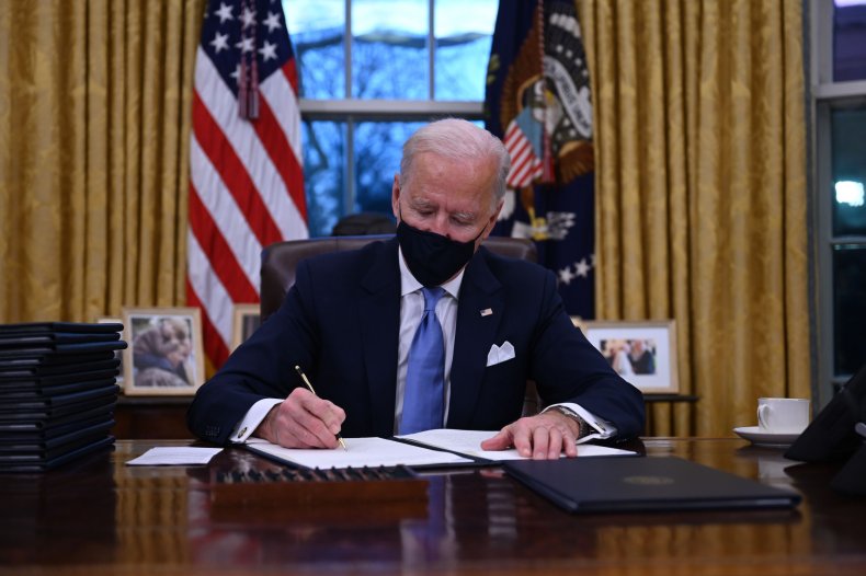 President Joe Biden sits in Oval Office