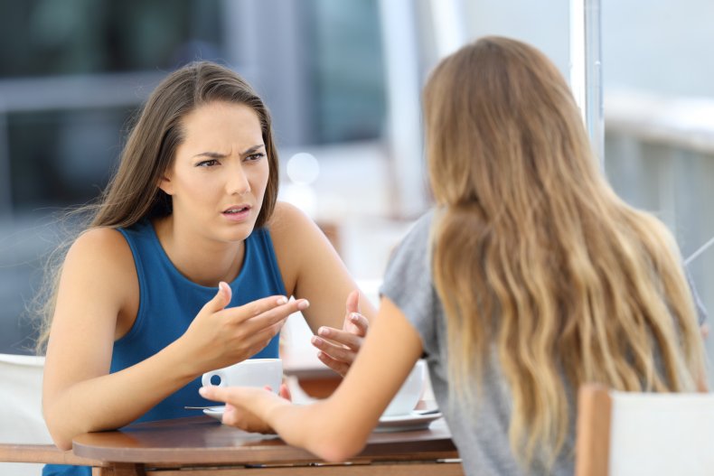 Women having tense conversation