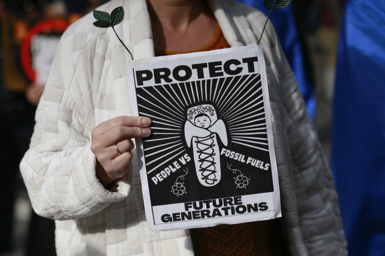 A protestor holds a sign