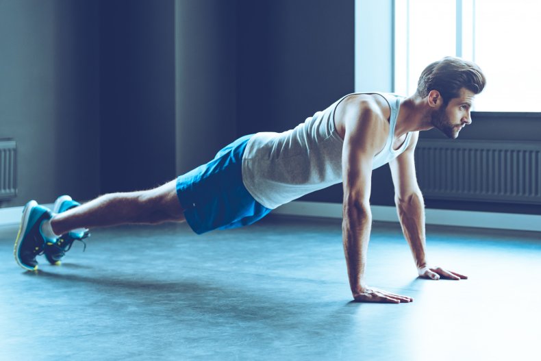 A man doing a push-up.