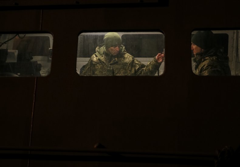 Ukrainian servicemen are seen inside a vessel
