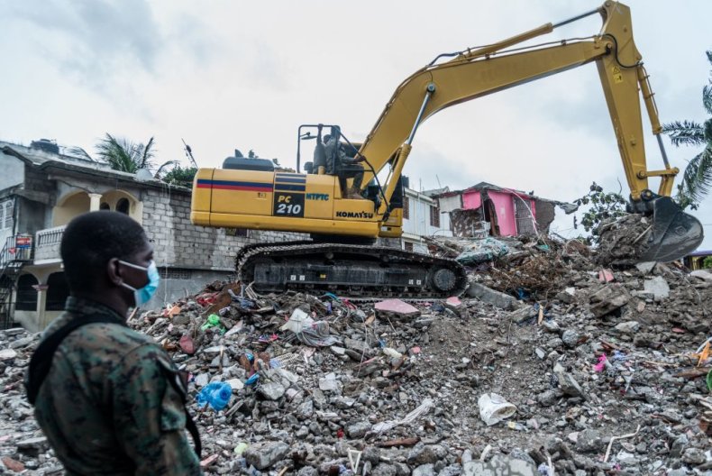 Bulldozer clearing rubble after Haiti 2021 earthquake