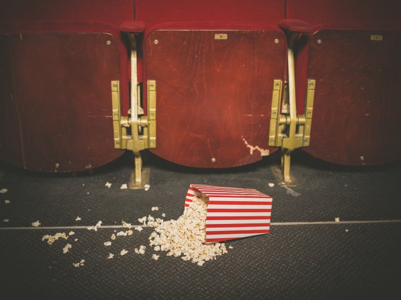Spilled popcorn on a movie theater floor.