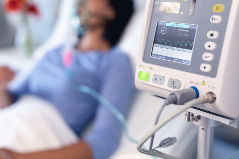 A woman on a ventilator in hospital