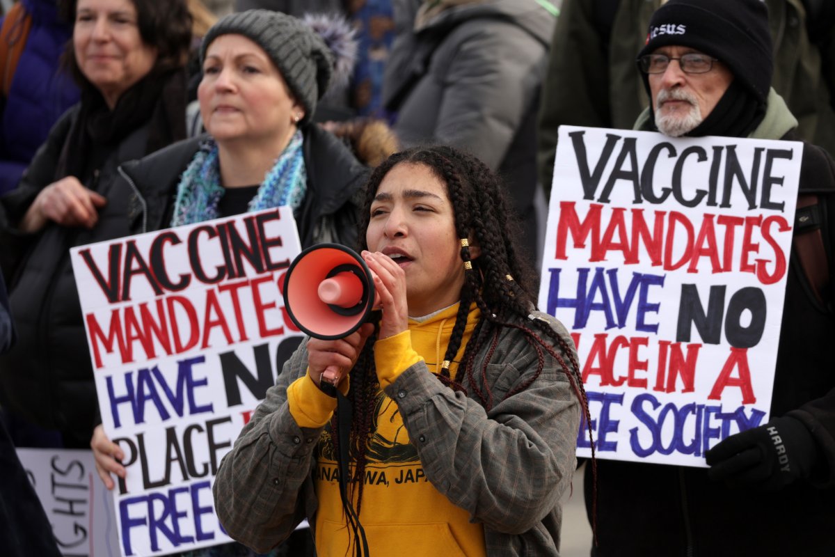 Anti-vaccination activists participate in a rally 