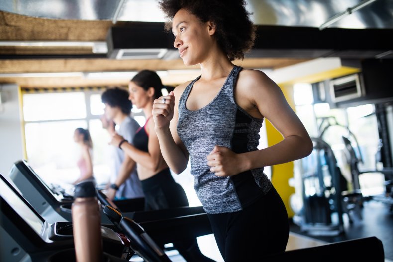 A group of people on treadmills.