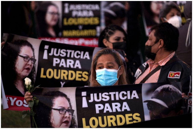 People holding signs with Lourdes Maldonado's name