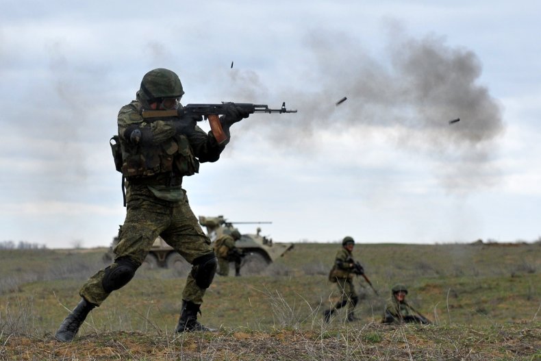 A Russian soldier shoots a rifle during exercises