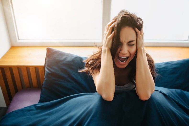 Woman screaming in bed