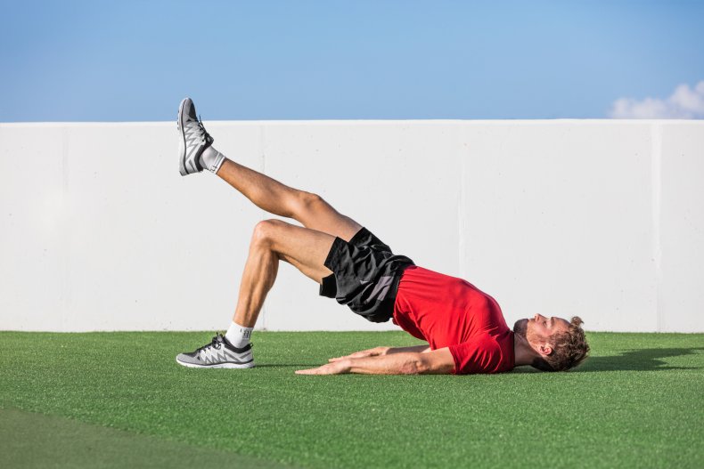 A man doing a hip thrust move.