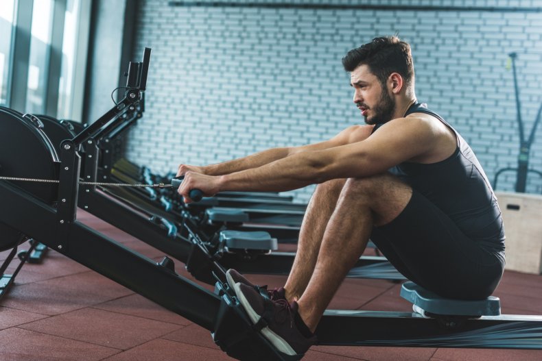 A man using a rowing machine.