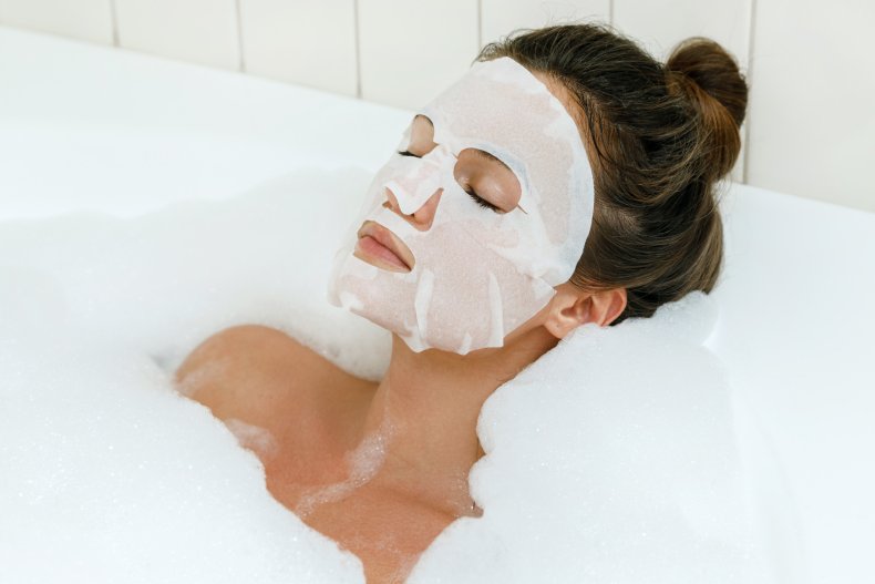 A woman wearing a sheet mask.