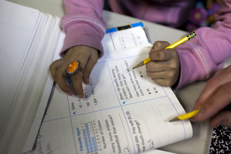Girl receives help with homework exercises