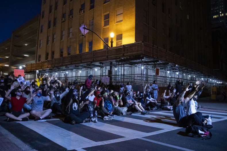 Protesters continue to gather after nightfall