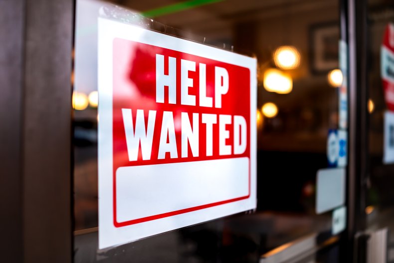 A shop window sign advertising a job.