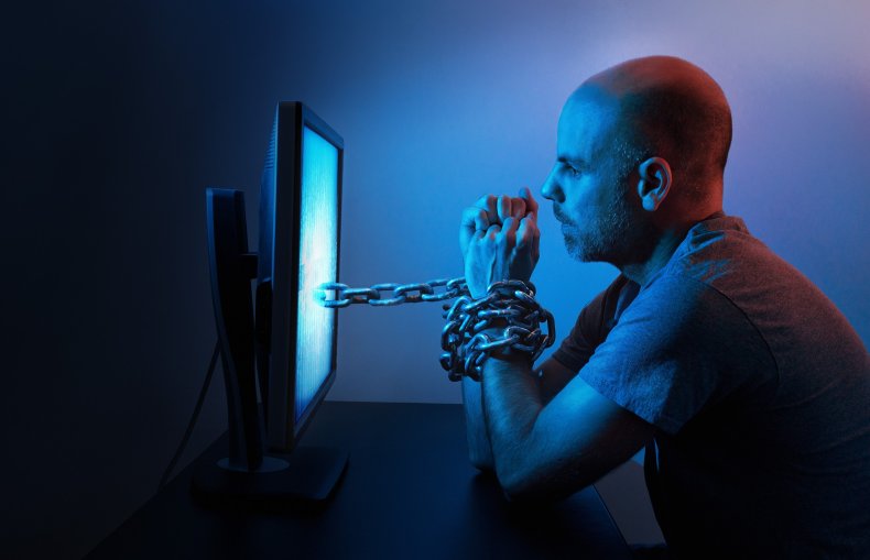 Man chained to computer
