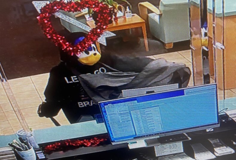 Man Wearing Sonic Mask Robbery