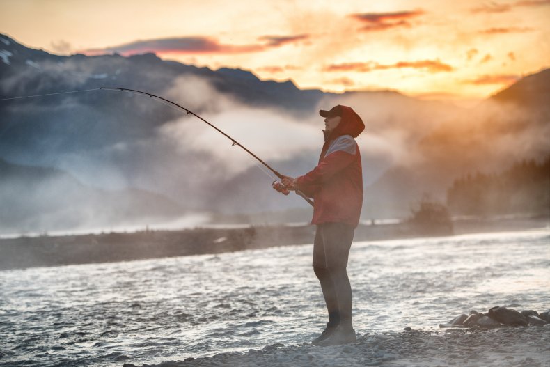 A man fishing in a river