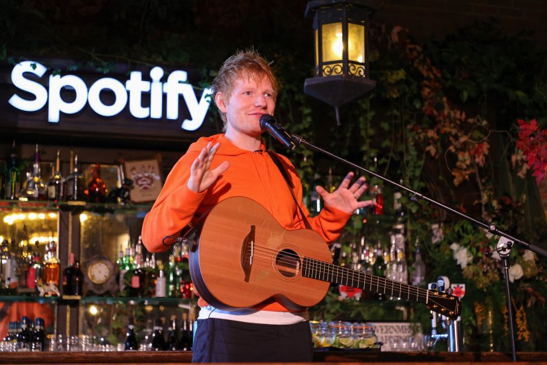 Ed Sheeran Next to Spotify Logo
