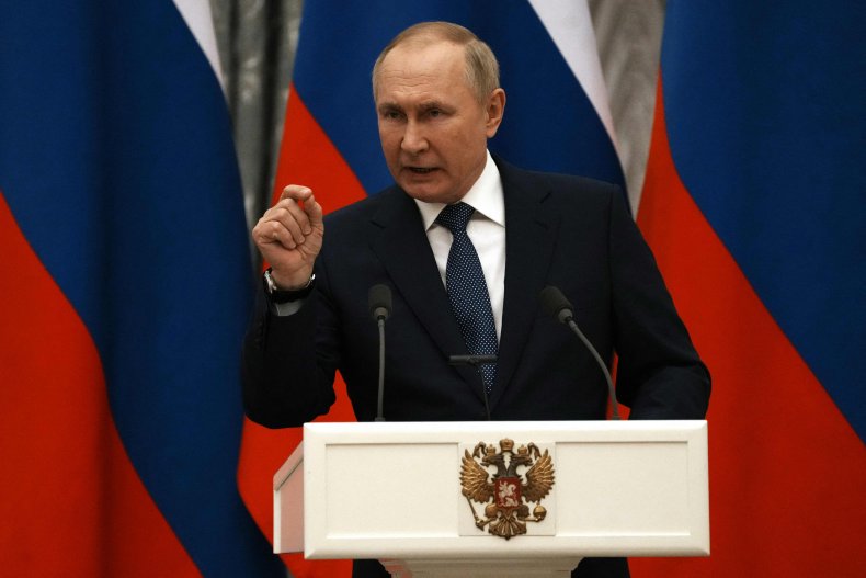 Russian President Vladimir Putin gestures 