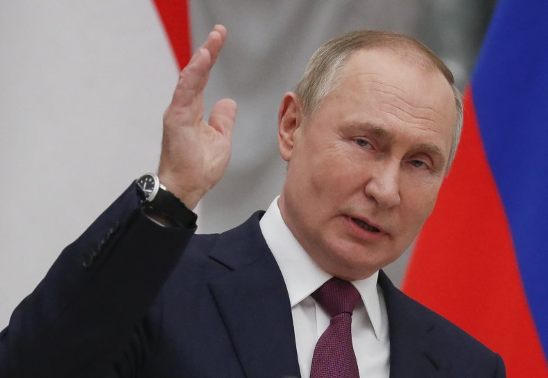 Russian President Vladimir Putin gestures