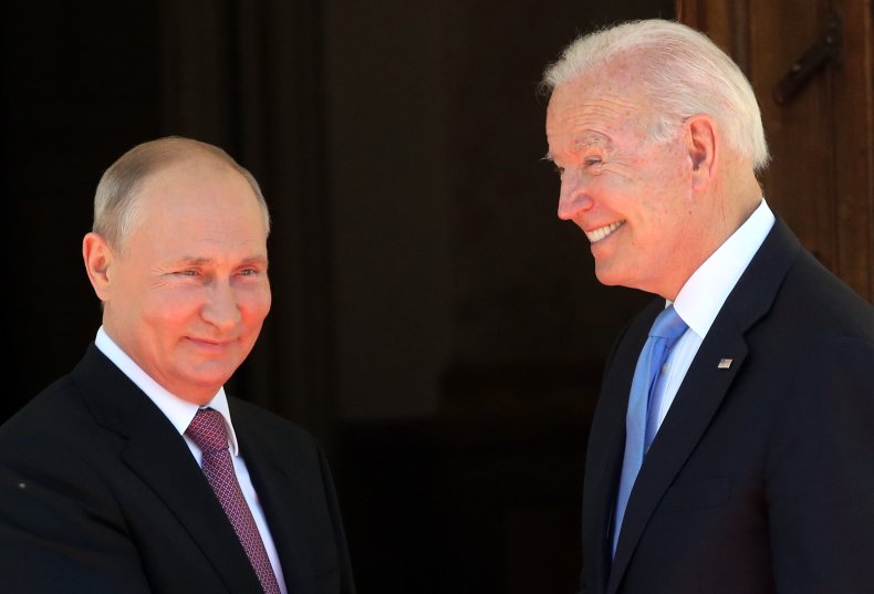 Vladimir Putin and Joe Biden shake hands