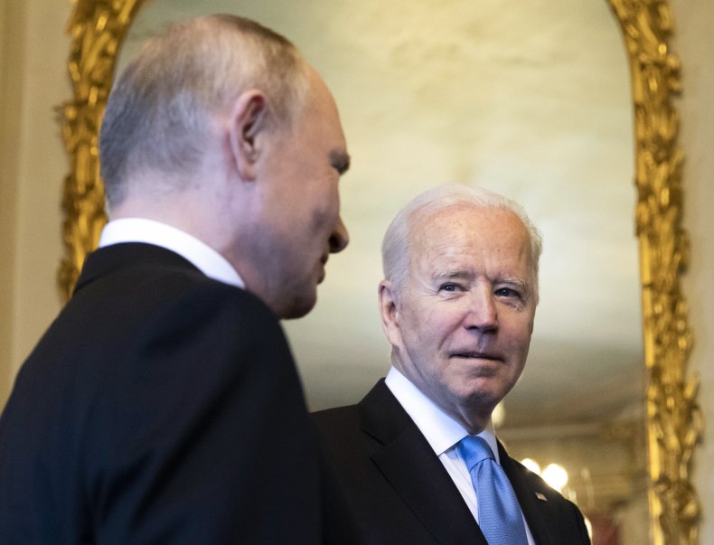 Putin and Biden stand near mirror