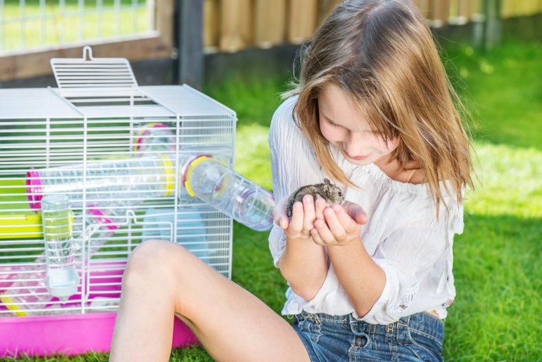 Girl sitting in the backyard with a