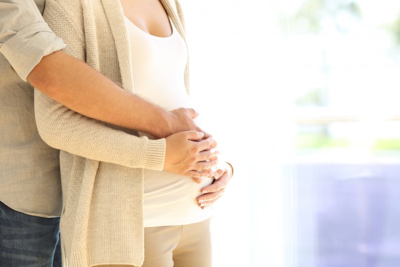 Pregnant belly couple
