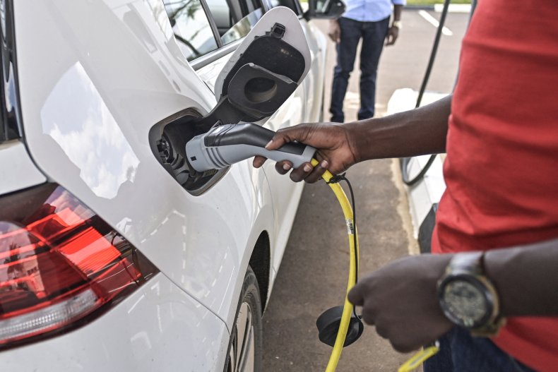 A man fits a charger to car