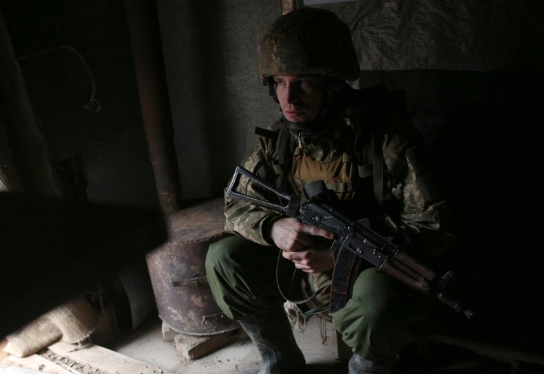 A Ukrainian Serviceman Waits in Position