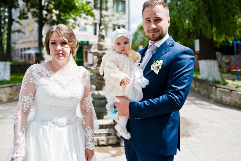Couple and baby at wedding