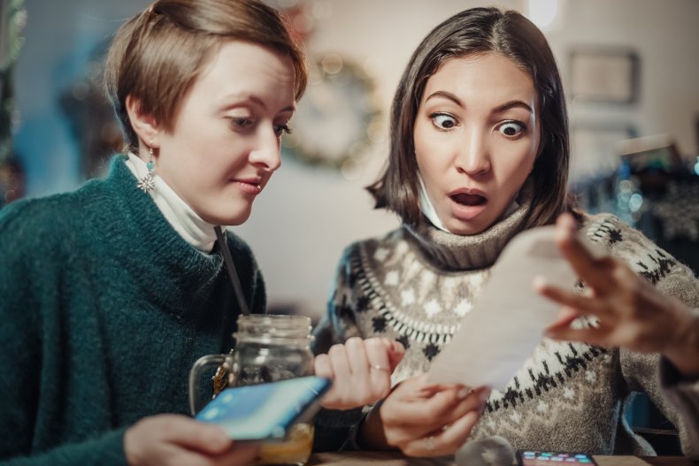 Women looking at check