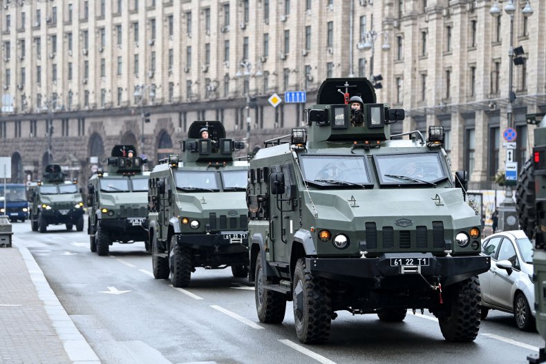 Ukrainian military vehicles move past Independence Square