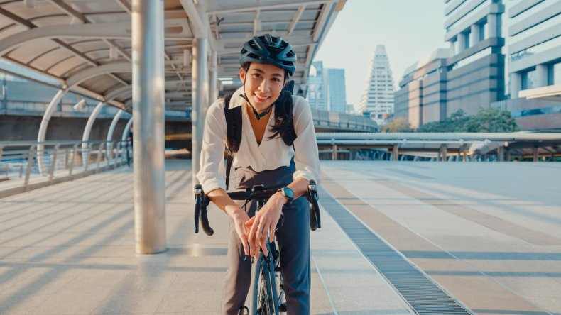 Woman stopped on bicycle