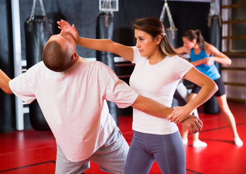 woman striking man in self defense