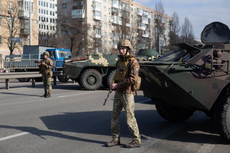 Ukrainian soldiers guard Kyiv checkpoint Ukraine Russia