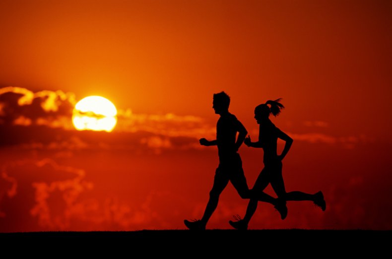 Runners at sunset