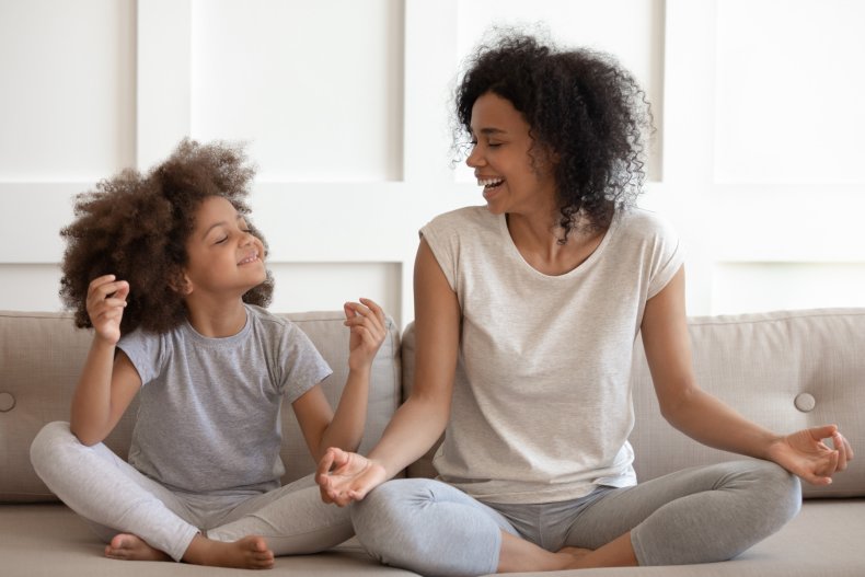 Woman and daughter yoga