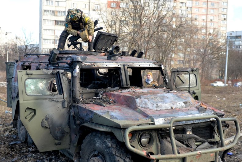 Ukraine troops on Russian vehicle in Kharkiv