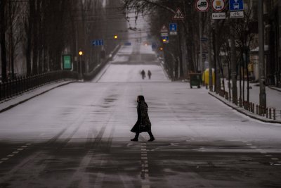 People walk along empty road in Kyiv People walk along empty road in Kyiv