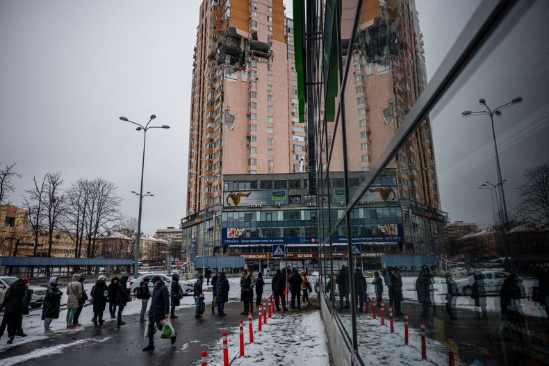 People outside a supermarket in Kyiv