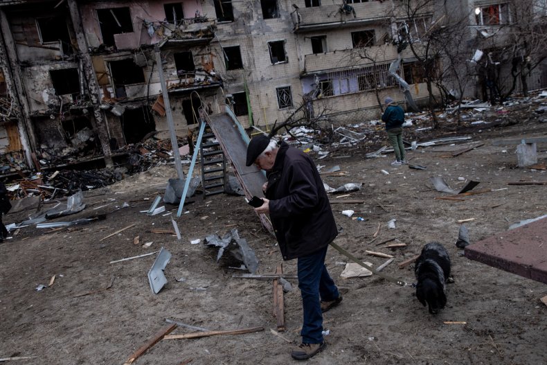 A man walks his dog in Ukraine