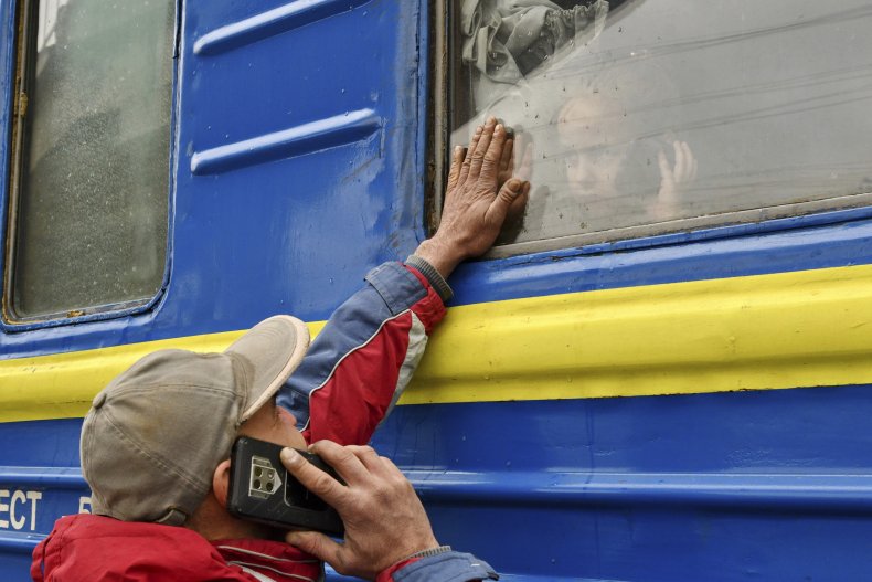 Ukrainian refugees leave on train